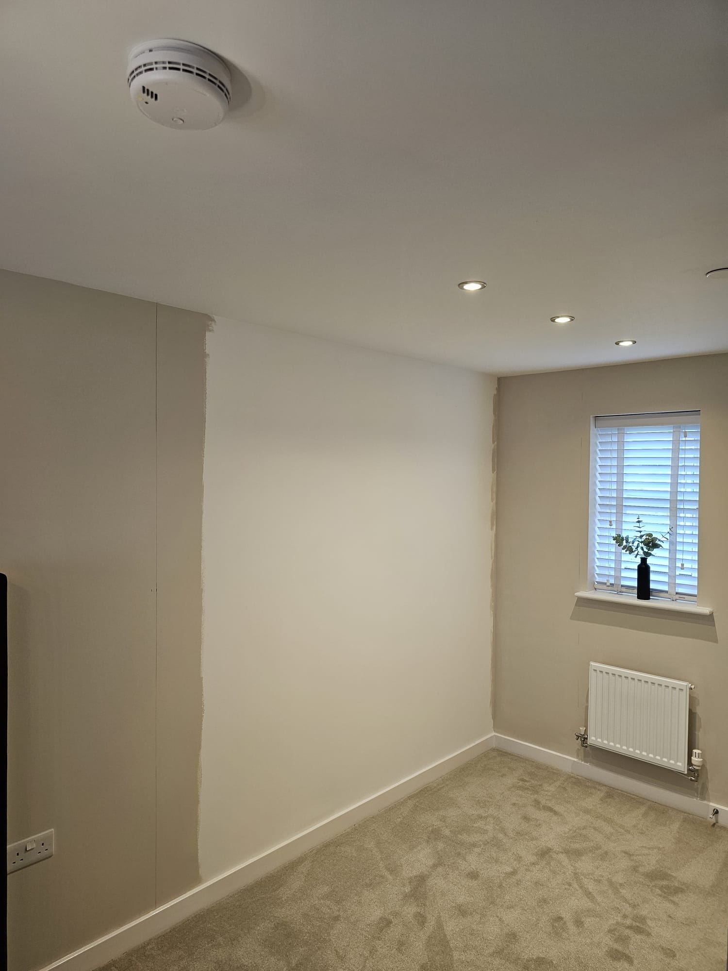 Bedroom wall before mirrored sliding wardrobe doors were fitted in Newport