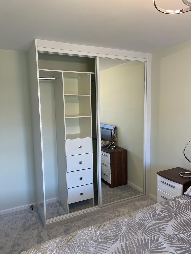 Drawers and shelves with hanging either side in Caerphilly