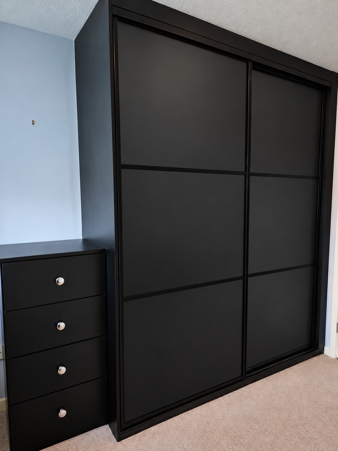 Matte black solid doors with a matching drawer unit in Newport