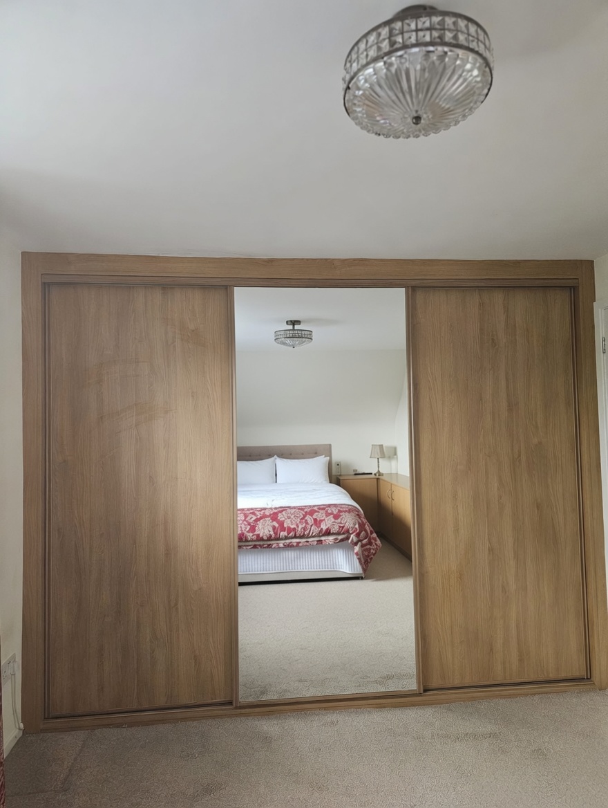 Full wall of solid doors with internal drawers in Swansea