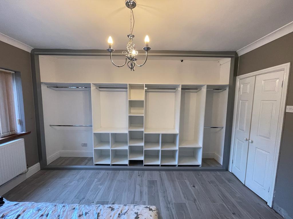 Grey frame with a full white storage run in Newport