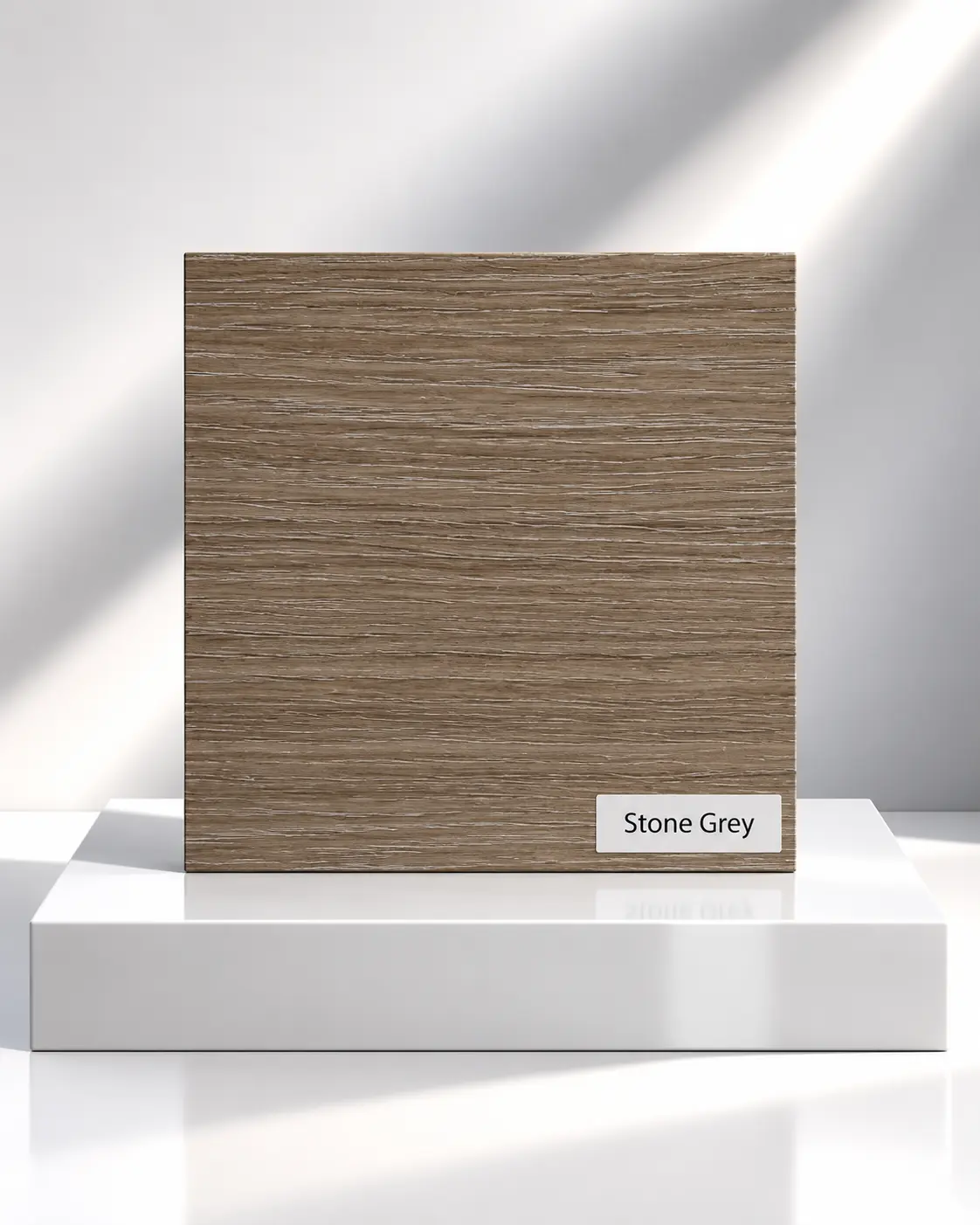 Stone Grey wood-effect wardrobe panel sample with horizontal grain on a white plinth