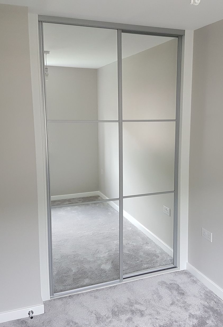 Full-height mirror doors with silver frames and horizontal bars in Ystradowen